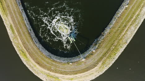 Water-treatment-pond-from-above-aerial-view-slow-motion-bubbles-of-water